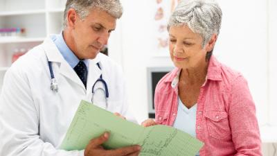 osteoporosis patient and doctor discussing diagnosis
